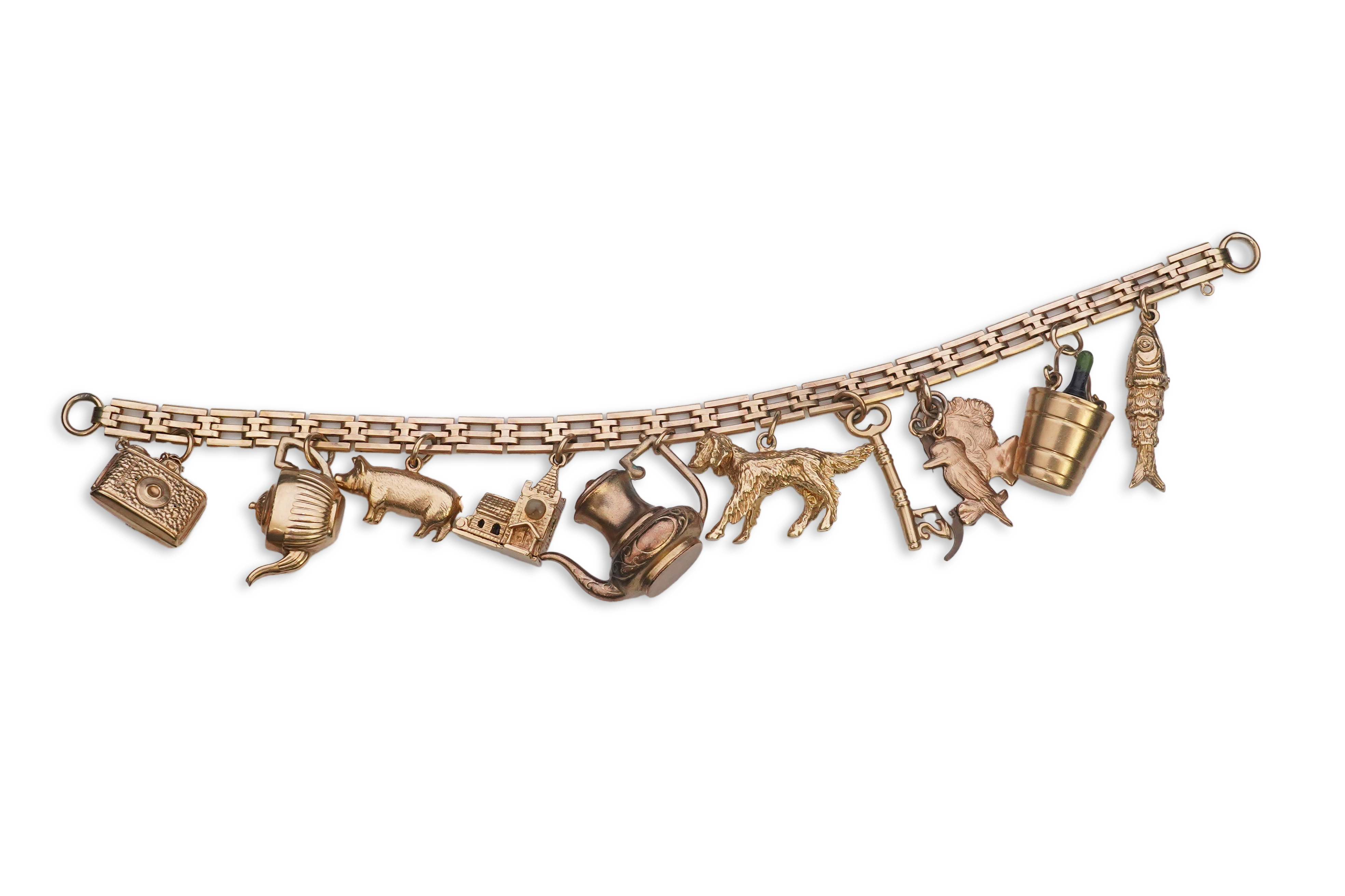 A charm bracelet, mid 20th century